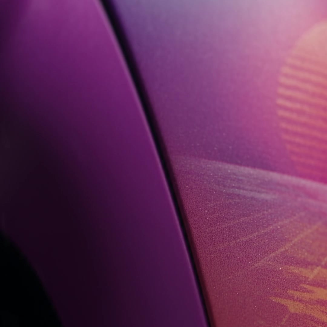 Illustrative trailer close-up of purple-pink shell finish and sunset artwork